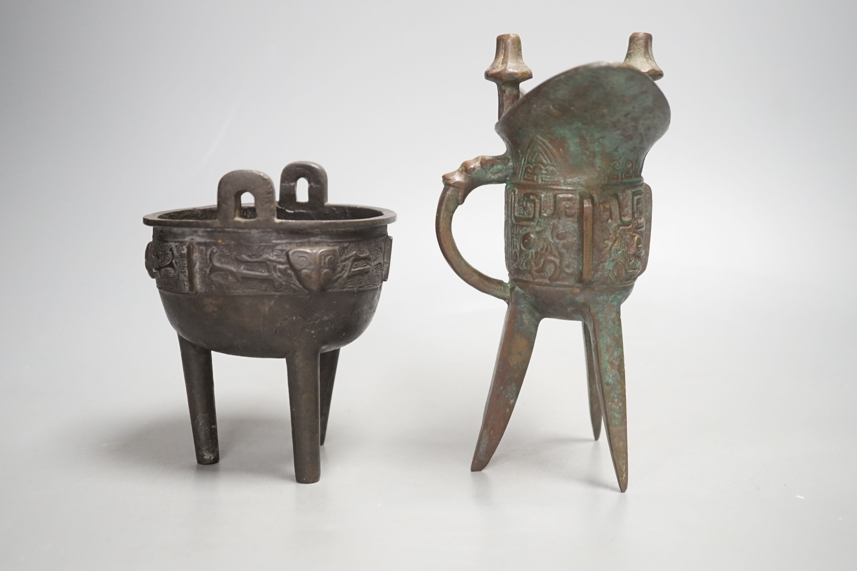 A Chinese bronze wine vessel and bronze tripod censer, wine vessel 19cms high